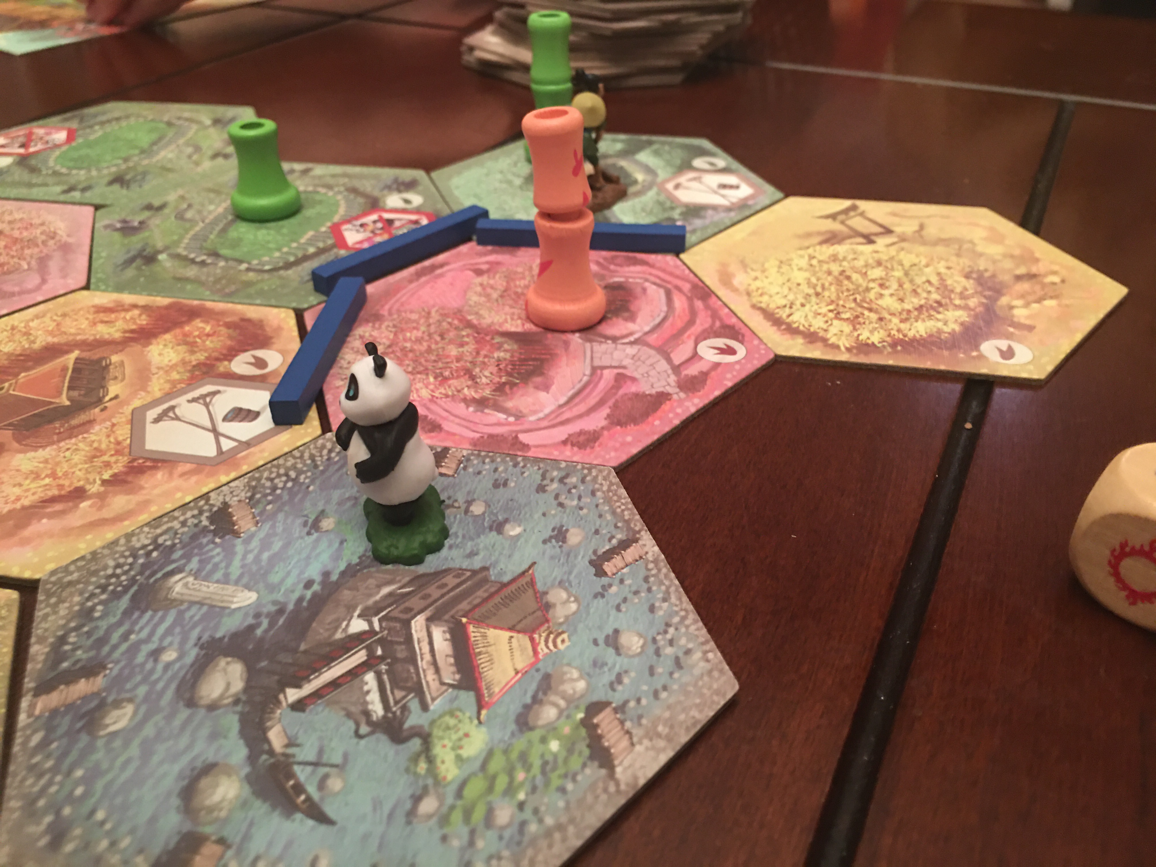 Panda next to a pagoda.