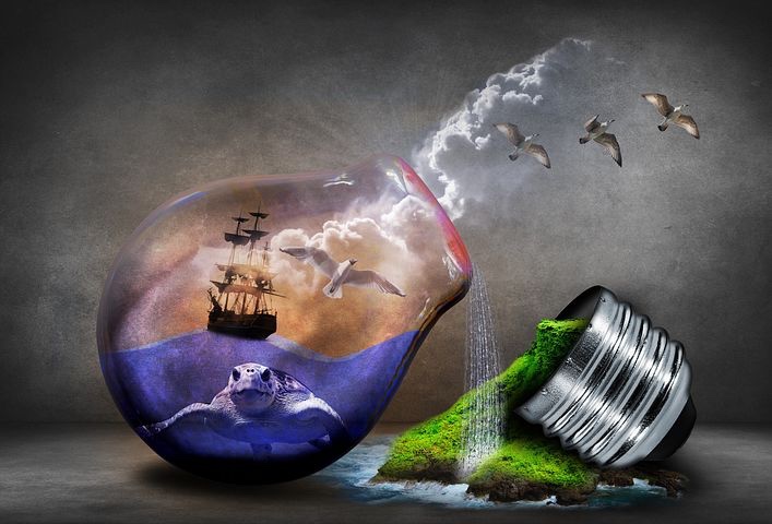 A fantastical, broken lightbulb with a ship on an ocean, and green grass bursting forth.
